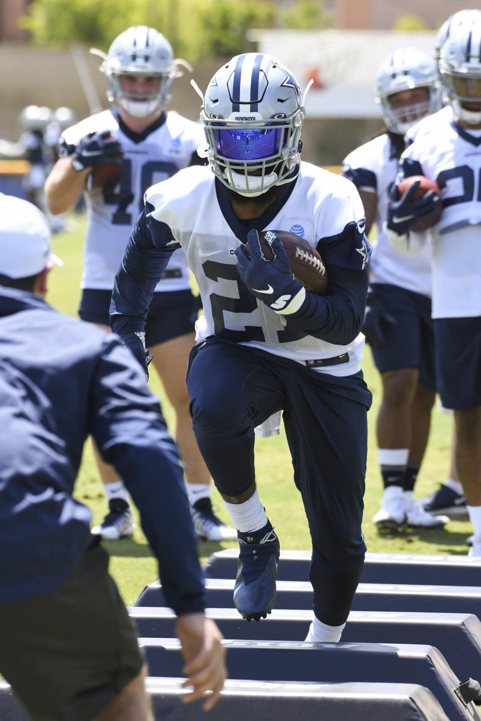 Dallas Cowboys running back Ezekiel Elliott runs a drill during practice at the NFL football team's training camp in Oxnard, Calif., Thursday, July 22, 2021. (AP Photo/Michael Owen Baker)