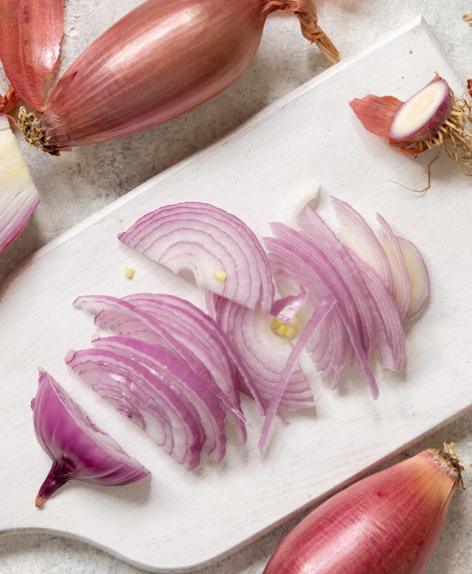 sliced shallots on a cutting board