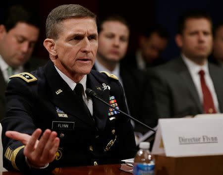 Defense Intelligence Agency director U.S. Army Lt. General Michael Flynn testifies before the House Intelligence Committee on "Worldwide Threats" in Washington February 4, 2014. REUTERS/Gary Cameron