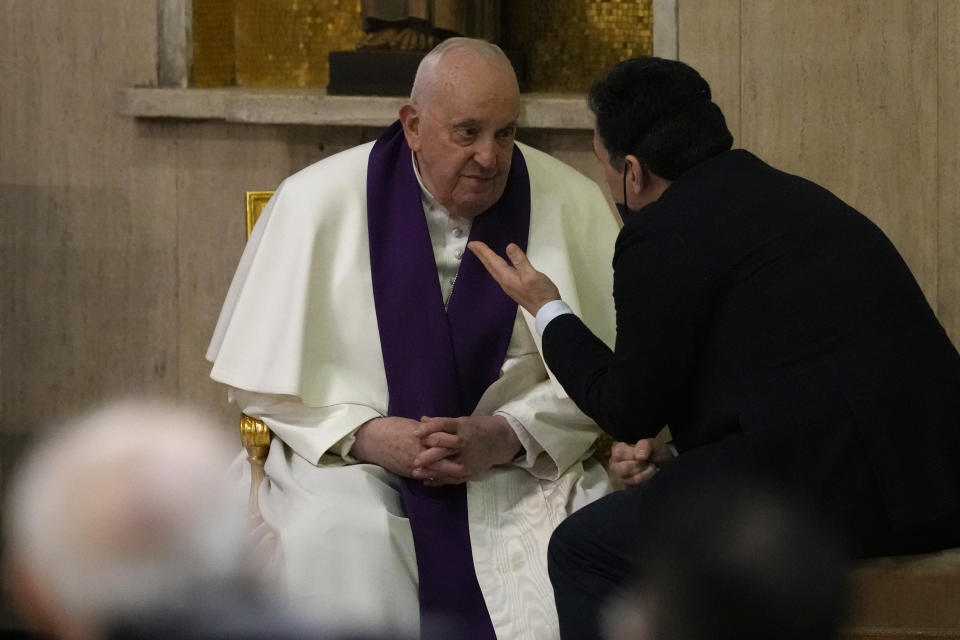 Pope Francis confesses a man as he visits the parish church of St. Pius V for the "24 hours for the Lord" Lenten initiative of prayer and reconciliation, in Rome, Friday, March 8, 2024. The event will be celebrated in dioceses around the world on the eve of the fourth Sunday of Lent, from Friday 8 to Saturday 9 March.(AP Photo/Andrew Medichini)