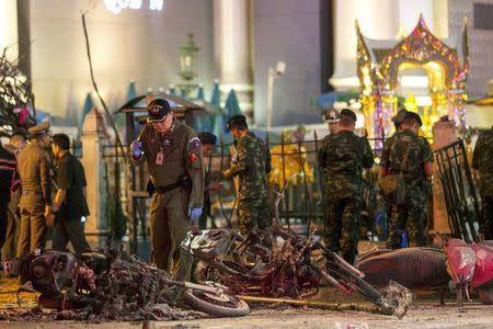 Experts investigate at the site of a blast in central Bangkok August 17, 2015. REUTERS/Athit Perawongmetha