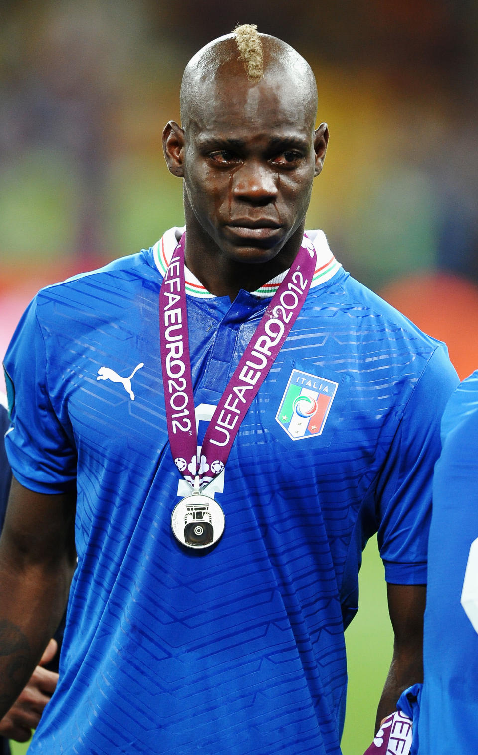 KIEV, UKRAINE - JULY 01: Mario Balotelli of Italy cries as he shows his dejection following defeat in the UEFA EURO 2012 final match between Spain and Italy at the Olympic Stadium on July 1, 2012 in Kiev, Ukraine. (Photo by Laurence Griffiths/Getty Images)