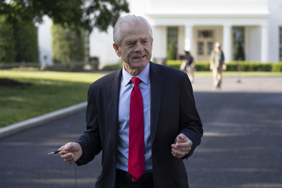 White House trade adviser Peter Navarro walks to do a television interview at the White House, Friday, May 15, 2020, in Washington. (AP Photo/Alex Brandon)