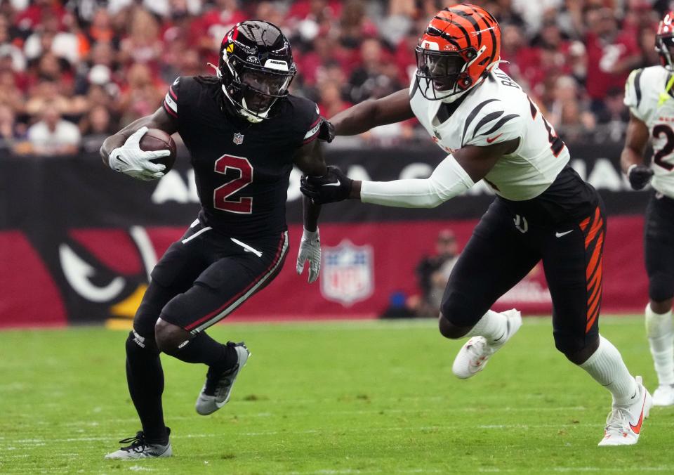 Arizona Cardinals receiver Marquise Brown (2) tries to get past Cincinnati Bengals safety Jordan Battle (27) at State Farm Stadium in Glendale on Oct. 8, 2023.