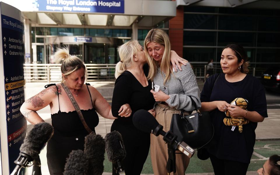  Hollie Dance (second left) surrounded by family and friends, outside the Royal London hospital in Whitechapel