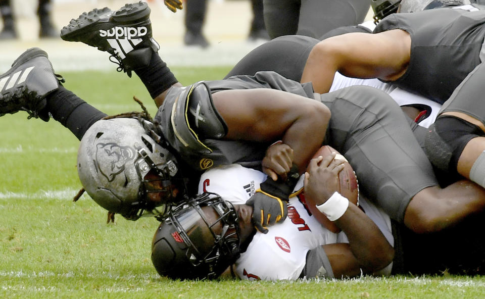 Pittsburgh defensive lineman Patrick Jones II sacks Louisville quarterback Malik Cunningham in the third quarter during an NCAA college football game at Heinz Field, Saturday, Sept. 26, 2020, in Pittsburgh. (Matt Freed/Pittsburgh Post-Gazette via AP)