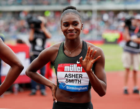 FILE PHOTO: Athletics - Diamond League - Birmingham Grand Prix - Alexander Stadium, Birmingham, Britain - August 18, 2018 Britain's Dina Asher-Smith waves after finishing second in the women's 200m Action Images via Reuters/Peter Cziborra/File Photo