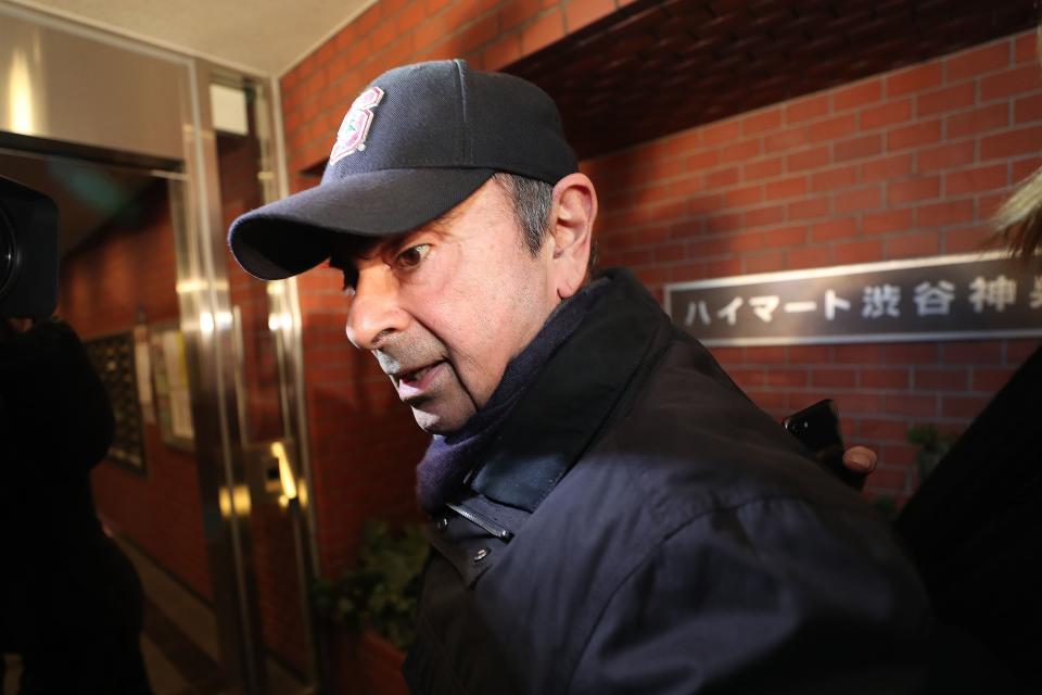 TOPSHOT - Former Nissan chairman Carlos Ghosn arrives at his residence in Tokyo on March 8, 2019. - Ghosn was freed from a Tokyo detention centre on the afternoon of March 6 after his shock arrest on November 19 when Japanese prosecutors stormed into his corporate jet. In keeping with conditions for his bail worth roughly $9 million, Ghosn has promised to live at a residence with surveillance cameras, to stay in Japan, and to use only designated computers with no internet access. (Photo by Behrouz MEHRI / AFP)        (Photo credit should read BEHROUZ MEHRI/AFP via Getty Images)