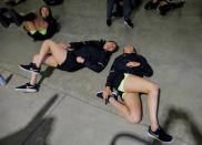 South Korean women's ice hockey player Marissa Brandt (R) and teammate Jin Gyu Lee (C) stretch following a game at Quinnipiac University in Hamden, Connecticut, U.S., December 28, 2017. REUTERS/Brian Snyder