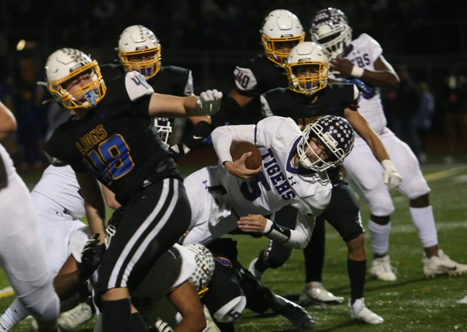 Pickerington Central's Braden Mantooth tries to fight through the Gahanna defense during the Division I Regional Semifinal game at DeSales on Nov. 11.