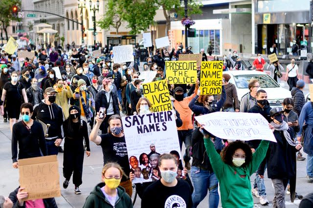 Demonstrators march in Oakland to protest the death of George Floyd 