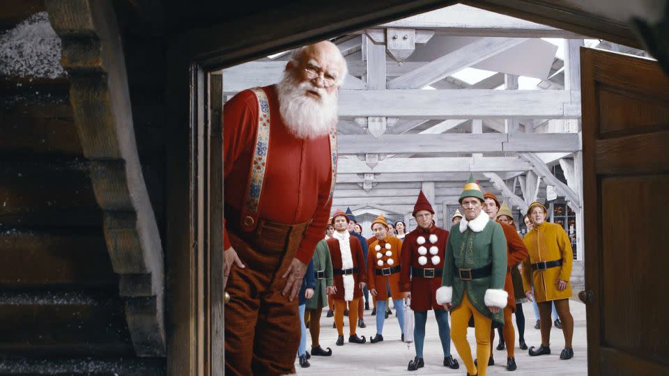 (from left) Ed Asner, Peter Billingsley and Bob Newhart in "Elf." - Moviestore/Shutterstock