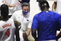 Florida head coach Mike White talks with his team in the first half of an NCAA college basketball game against Army, Wednesday, Dec. 2, 2020, in Uncasville, Conn. (AP Photo/Jessica Hill)