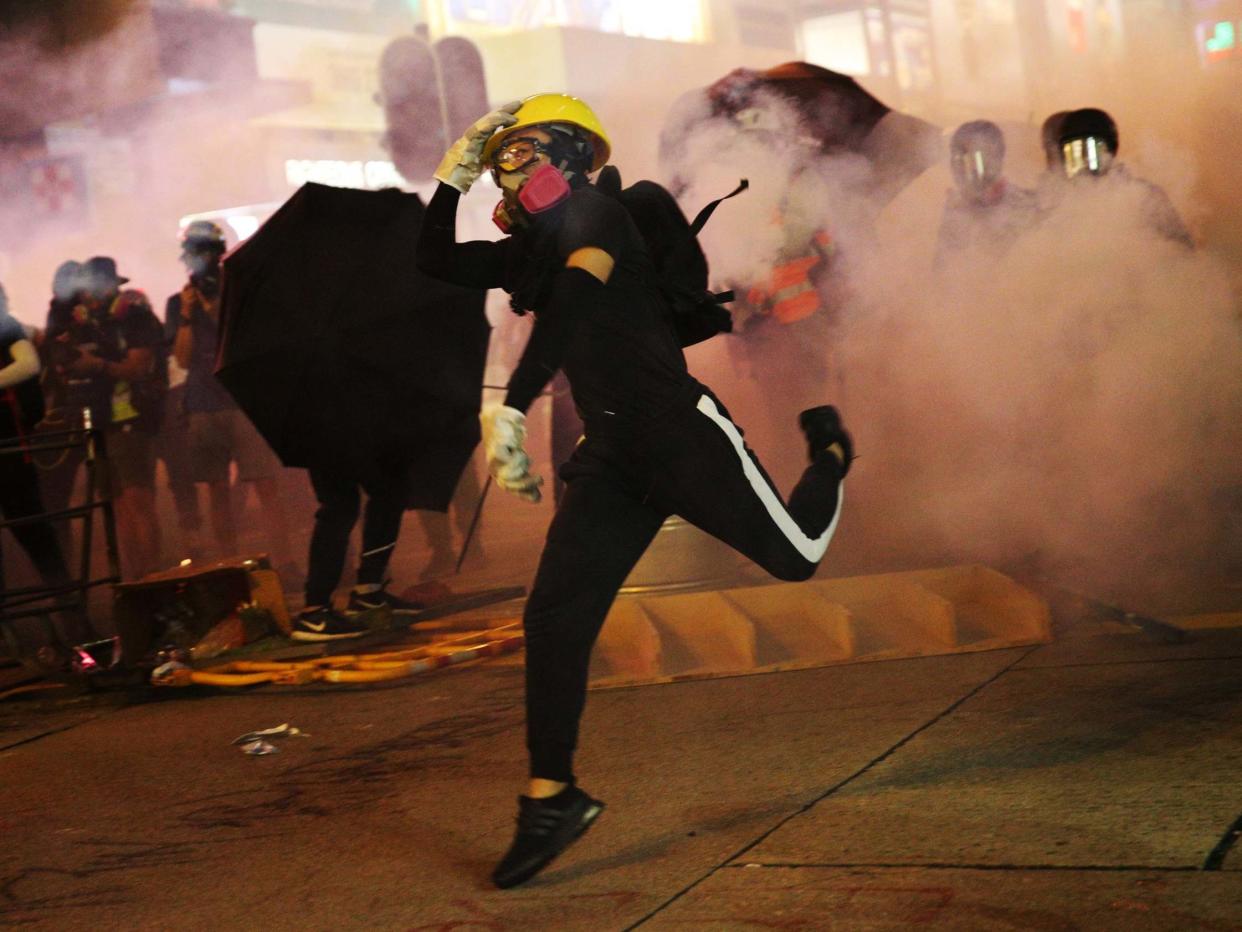 Police officers fired tear gas at protesters during the rally: EPA