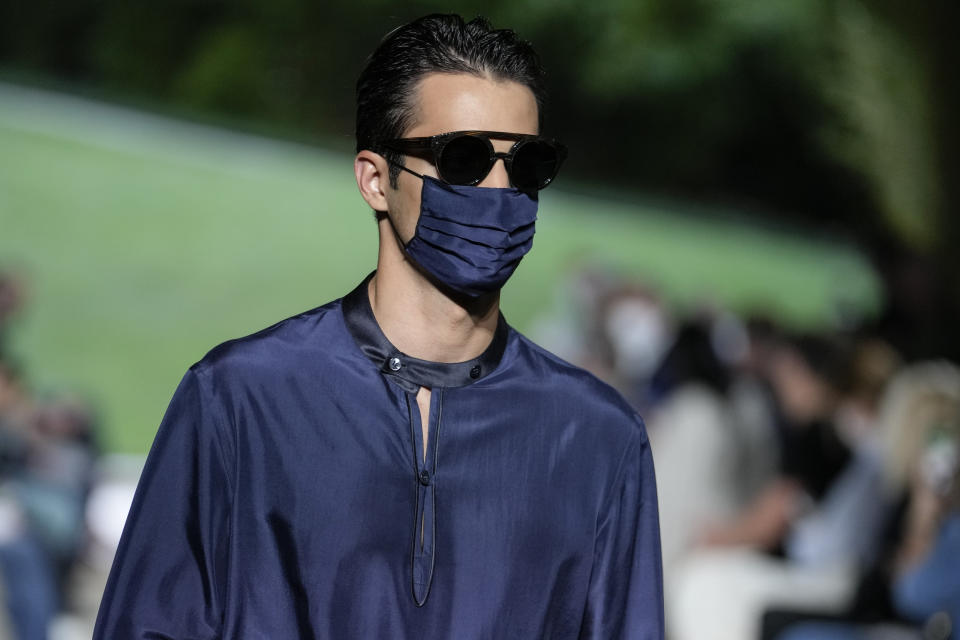 A model wears a creation as part of the Giorgio Armani men's Spring Summer 2022 collection, in Milan, Italy, Monday, June 21, 2021. (AP Photo/Luca Bruno)