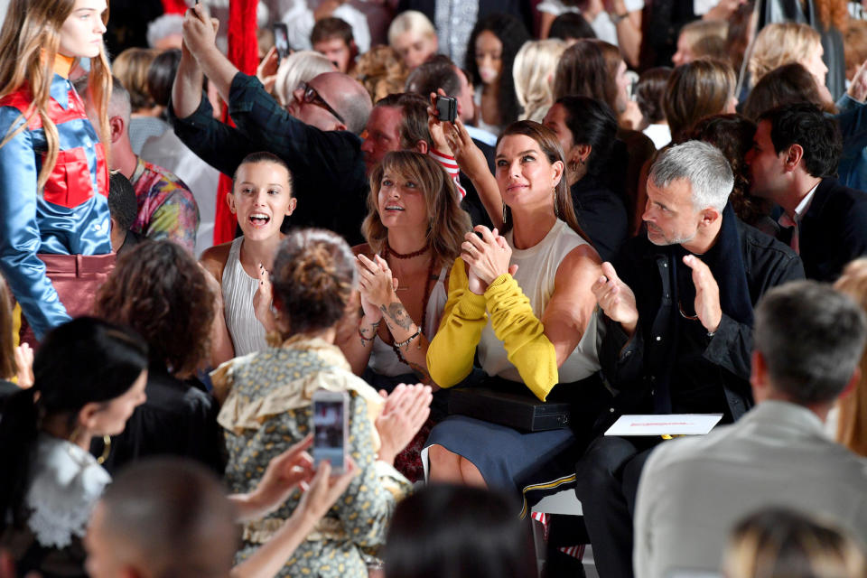 Millie Bobby Brown watches the Calvin Klein SS18 show alongside Paris Jackson and Brooke Shields [Photo: Getty]