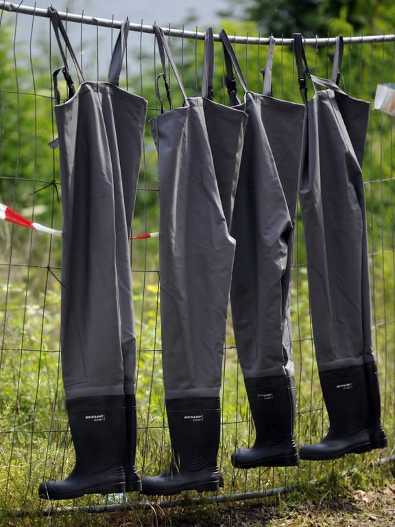 Wading trousers for drying on a fence in Magdeburg, eastern Germany, on June 11, 2013. Deadly floods forging a path of devastation through central Europe for more than a week bore down on northern Germany Tuesday as troops raced to bolster sodden dykes