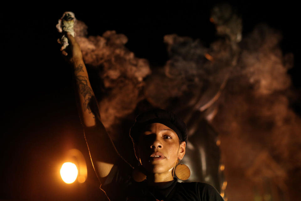 <p>A demonstrator burns sage at the Martin Luther King Jr. Historical Site during a protest in Atlanta on Friday, Sept. 23, 2016 in response to the police shooting deaths of Terence Crutch in Tulsa, Okla. and Keith Lamont Scott in Charlotte, N.C. (AP Photo/Branden Camp)</p>