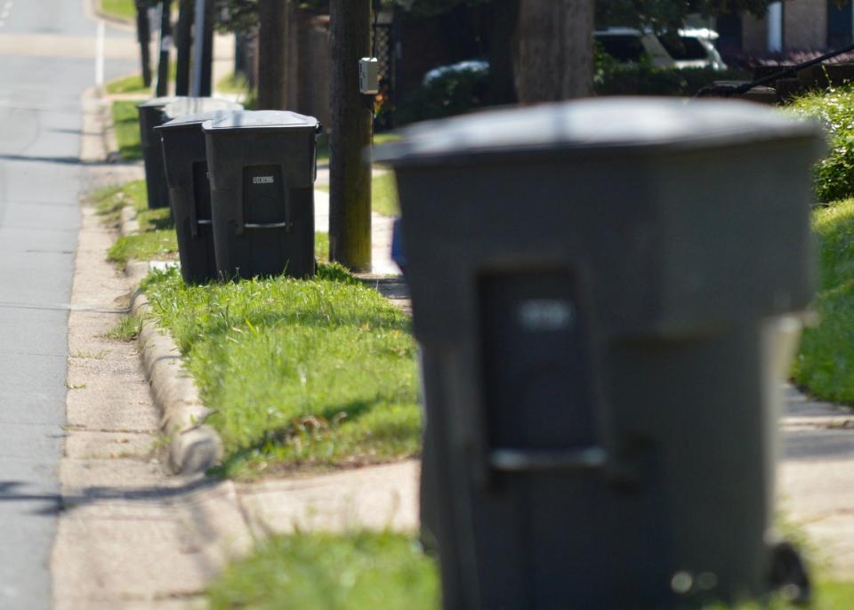Garbage bins line a curb near Shreveport's South Highland neighborhood on Tuesday, April 21, 2020.