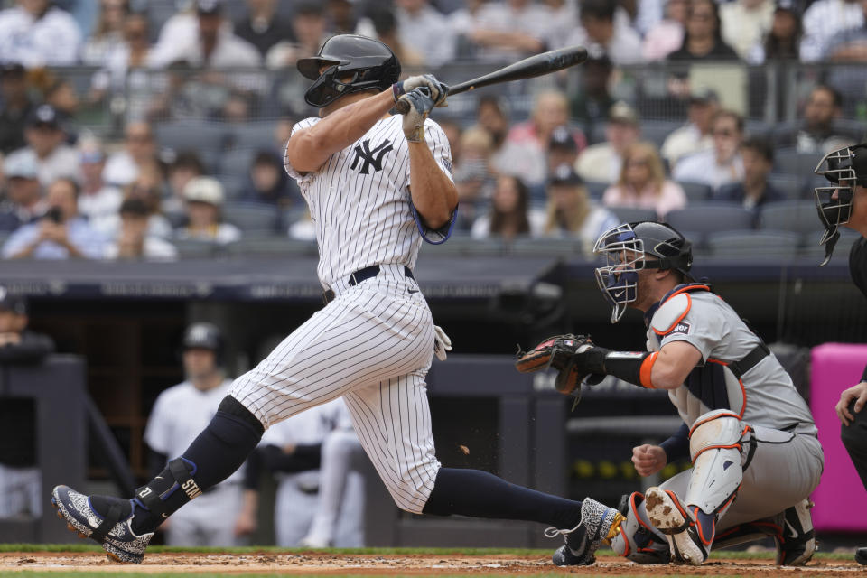 New York Yankees' Giancarlo Stanton follows through after hitting a RBI single in the first inning of a baseball game against the Detroit Tigers, Saturday, May 4, 2024, in New York. (AP Photo/Mary Altaffer)