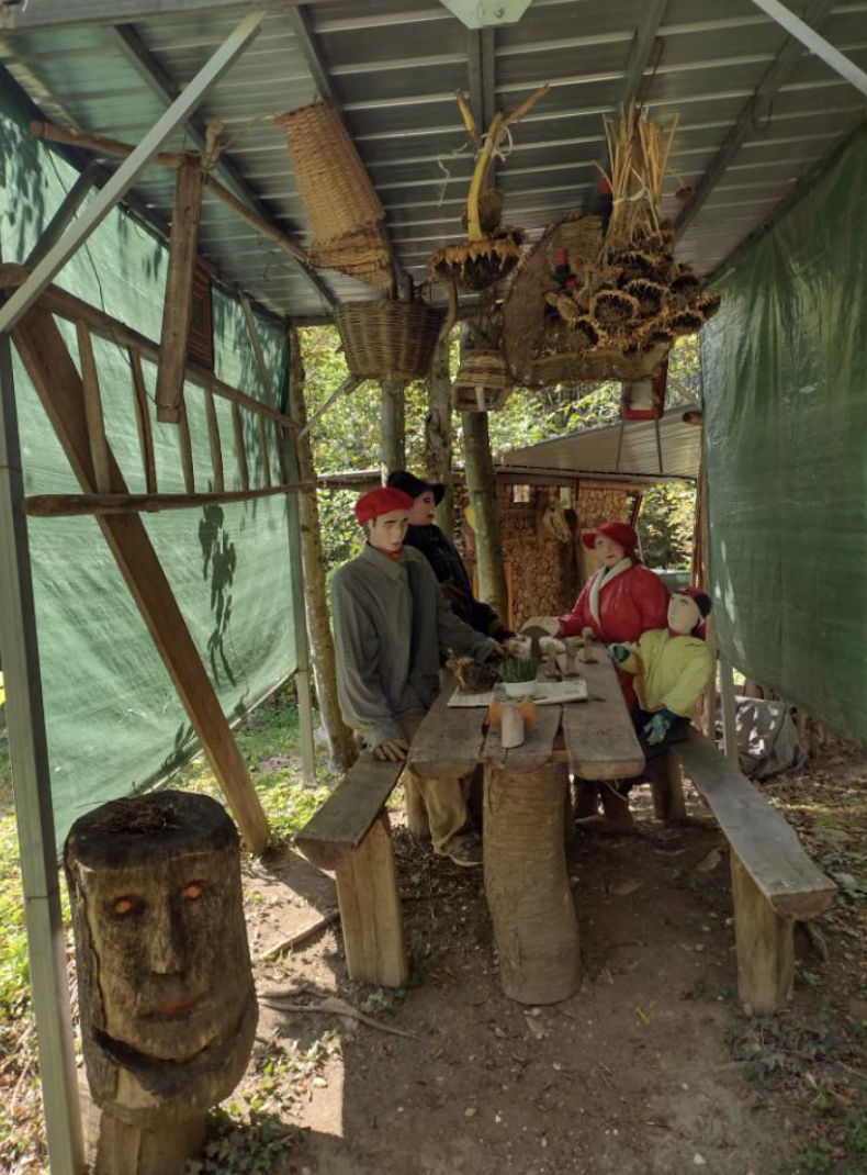 a paper mache family in the woods