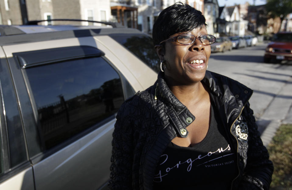 Yvette Osborne speaks after dropping her three children off at Benjamin E. Mays Academy Wednesday morning, Sept. 19, 2012, after Chicago teachers voted to suspend their first strike in 25 years. Union delegates voted overwhelmingly Tuesday night to suspend the walkout after discussing a proposed contract settlement with the nation's third largest school district. (AP Photo/M. Spencer Green)