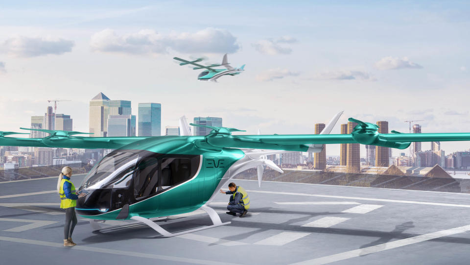 This artist's rendering depicts an Eve Air Mobility electric "air taxi" at an urban helipad.