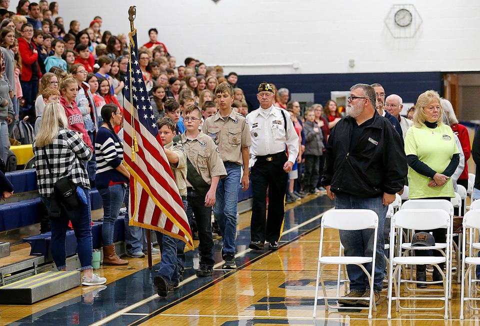 Members of Jeromesville Boy Scout Troop 521 present the colors during a Veterans Day program at Hillsdale High School on Friday.