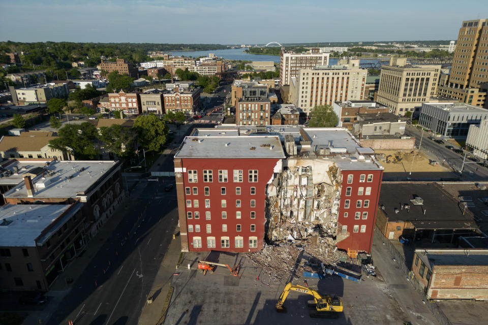 An apartment building that partially collapsed two days earlier can be seen Tuesday, May 30, 2023, in Davenport, Iowa. Five residents of the six-story apartment building remained unaccounted for and authorities fear at least two of them might be stuck inside rubble that was too dangerous to search. (AP Photo/Erin Hooley)