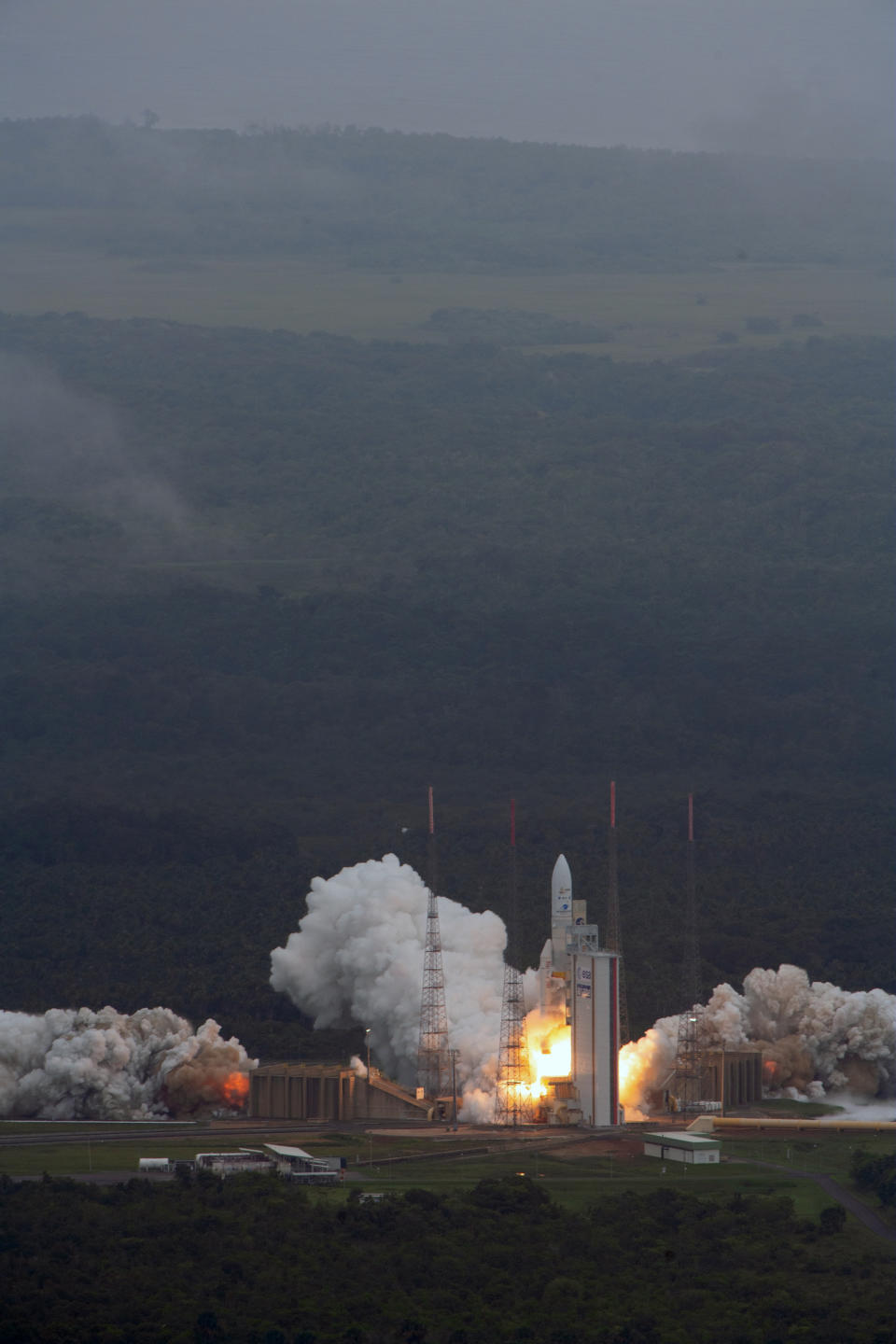 Arianespace's Ariane 5 rocket with NASA's James Webb Space Telescope onboard, lifts off Saturday, Dec. 25, 2021, at Europe's Spaceport, the Guiana Space Center in Kourou, French Guiana. The world's largest and most powerful space telescope has blasted off on a high-stakes quest to behold light from the first stars and galaxies. NASA's James Webb Space Telescope rocketed away Saturday from French Guiana in South America. (ESA-Stephane Corvaja via AP)