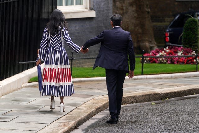 Akshata Murty and Rishi Sunak hold hands as they leave Downing Street