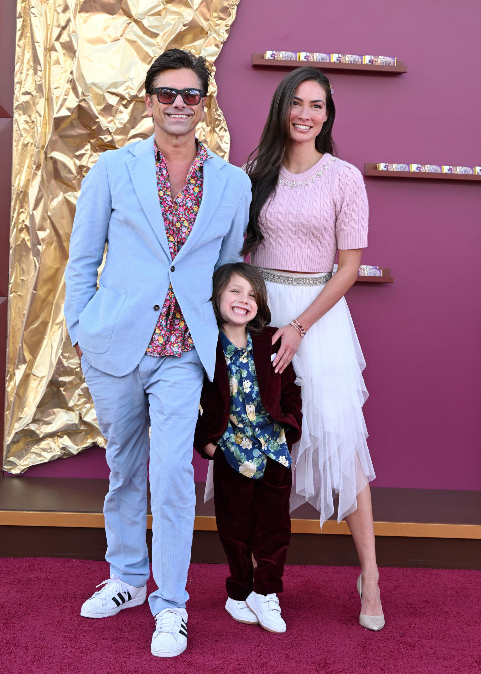 the family dressed up on the red carpet