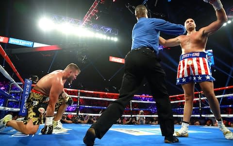 Tyson Fury celebrates as Tom Schwarz takes a knee - Credit: pa