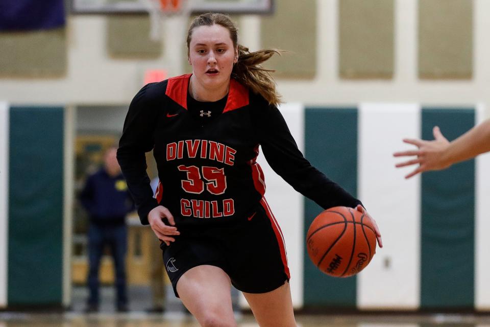 Dearborn Divine Child guard Kennedy Blair dribble against Ann Arbor Richard during the first half in Ann Arbor on Tuesday, Jan. 31, 2023.