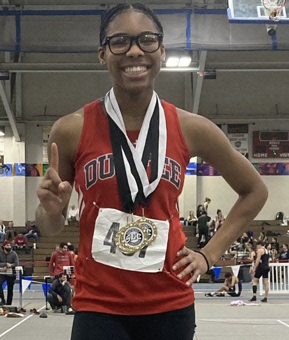 Durfee track and field athlete Shakira Cadet poses with her three medals at the Southeast Conference championships in Boston.