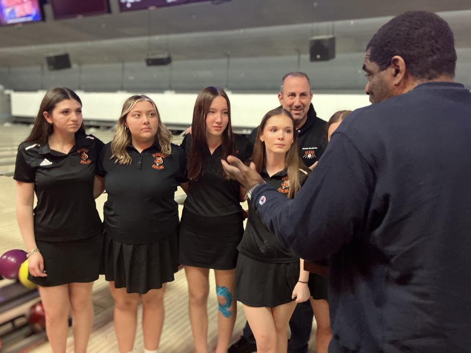 NJSIAA team bowling finals at Bowlero North Brunswick on Tuesday, Feb. 27, 2024. Barnegat accepts the Group 2 girls trophy from NJSIAA Director of Bowling Derryk Sellers. The Bengals bested Holy Angels for their school's first state title in any sport.