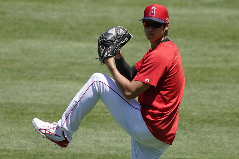 Los Angeles Angels' Shohei Ohtani pitches during baseball practice at Angels Stadium, Monday, July 6, 2020, in Anaheim, Calif. (AP Photo/Ashley Landis)