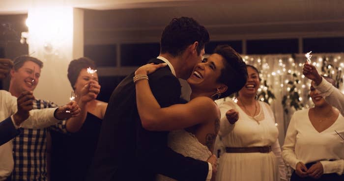 A bride and groom dance together