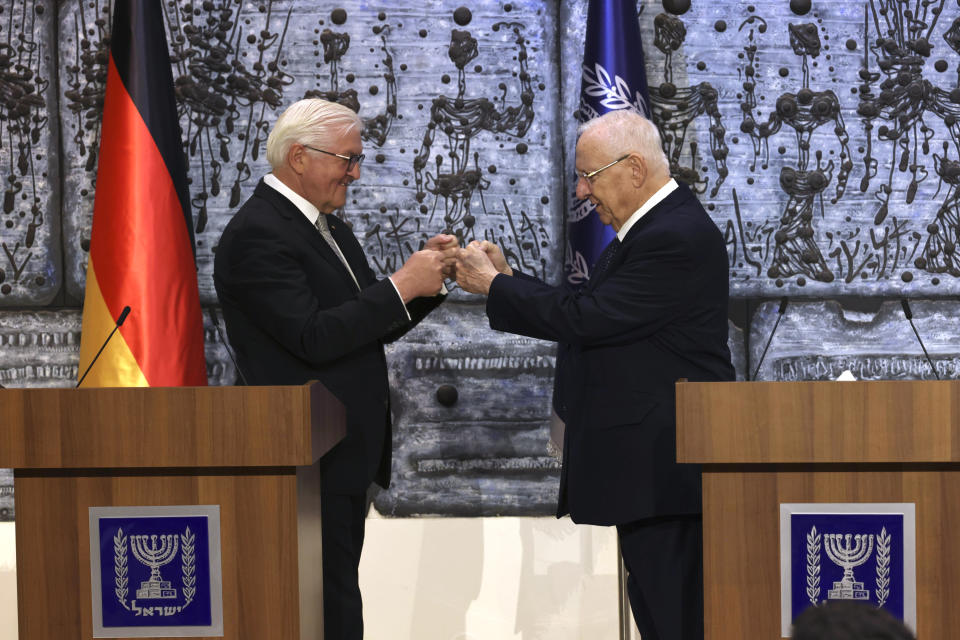 Israeli President Reuven Rivlin, right, and German President Frank-Walter Steinmeier fist bump, at the President's residence in Jerusalem, Thursday, July 1, 2021. (AP Photo/Tsafrir Avayov)