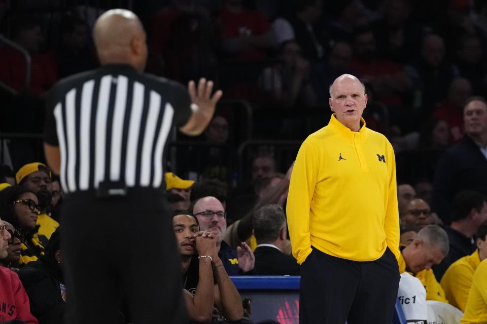 Michigan head coach Phill Martelli argues a call during the first half of an NCAA college basketball game against St. John's, Monday, Nov. 13, 2023, in New York. (AP Photo/Frank Franklin II)