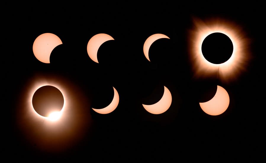 In this composite of eight photographs, the moon passes by the sun into totality and away again during a total solar eclipse in Bloomington, Indiana, on April 8, 2024. (Photo by JOSH EDELSON/AFP via Getty Images)