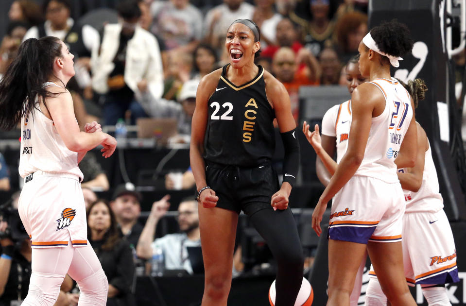 Las Vegas Aces forward A'ja Wilson (22) celebrates after scoring a basket against the Phoenix Mercury during the first half of a WNBA basketball game Sunday, Sept. 10, 2023, in Las Vegas. (Steve Marcus/Las Vegas Sun via AP)