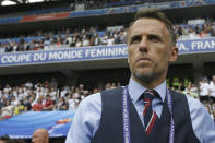 England head coach Philip Neville arrives on the pitch before the start of the Women's World Cup Group D soccer match between England and Scotland in Nice, France, Sunday, June 9, 2019. (AP Photo/Claude Paris)