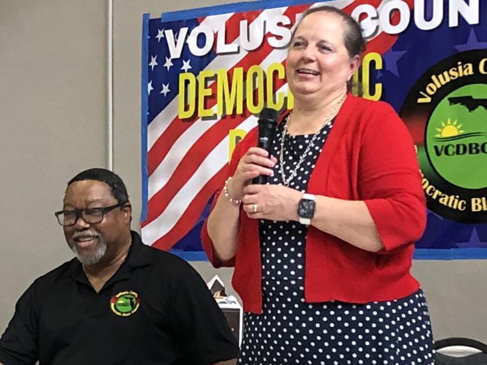 Volusia County Supervisor of Elections Lisa Lewis shares a laugh with L. Ronald Durham, president of the Volusia County Democratic Black Caucus during a forum on May 17, 2022, in DeLand.