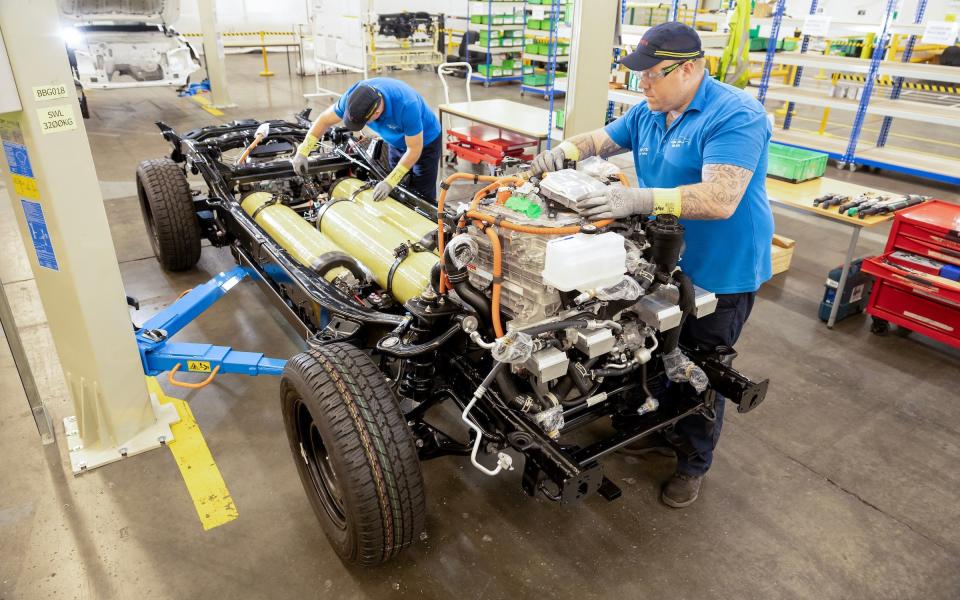 Toyota will continue to develop its hydrogen fuel cell packages for some models, including this prototype of an electrified Toyota Hilux pickup