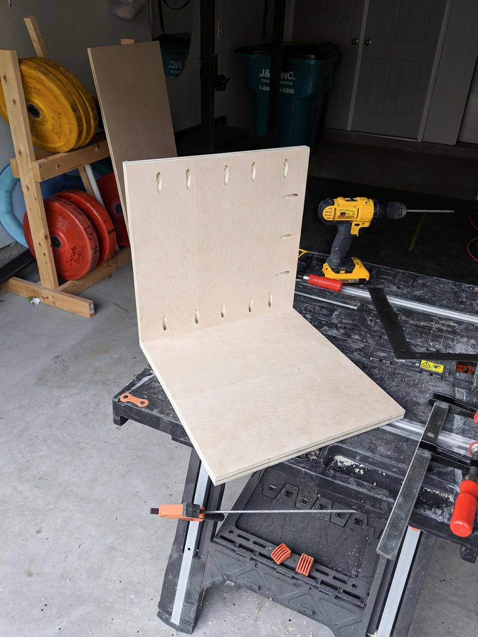 Two wooden boards for cat house at right angle