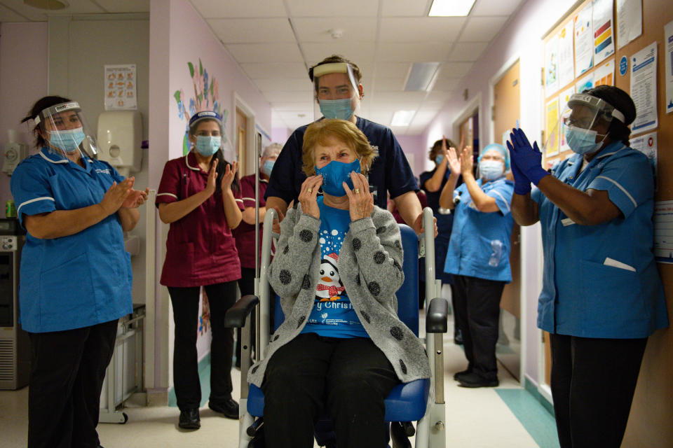 Margaret Keenan, 90, is applauded by staff as she returns to her ward after becoming the first person in the United Kingdom to receive the Pfizer/BioNtech covid-19 vaccine at University Hospital, Coventry, at the start of the largest ever immunisation programme in the UK's history.