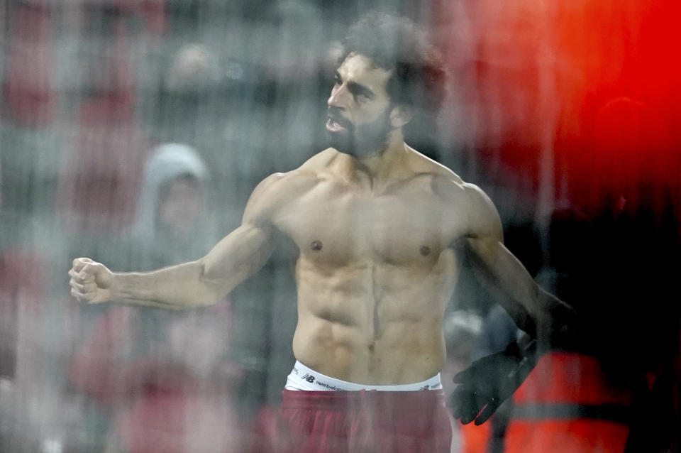 Liverpool's Mohamed Salah celebrates scoring his side's second goal during the English Premier League soccer match between Liverpool and Manchester United at Anfield Stadium in Liverpool, Sunday, Jan. 19, 2020.(AP Photo/Jon Super)