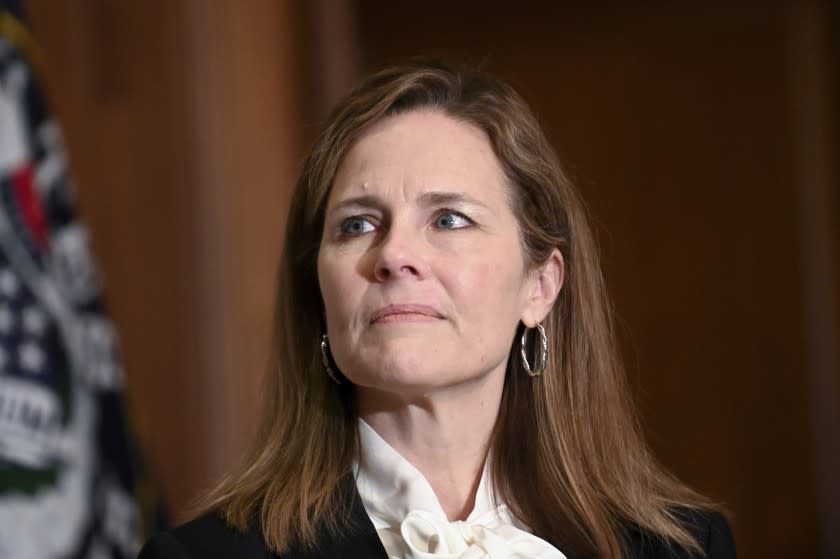 Judge Amy Coney Barrett, President Donald Trumps nominee for the U.S. Supreme Court, meets with Sen. Kevin Cramer, R-N.D., on Capitol Hill in Washington, Thursday, Oct. 1, 2020. (Erin Scott/Pool via AP)