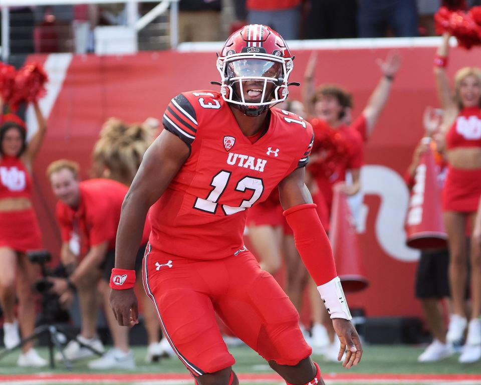 Utah Utes quarterback Nate Johnson (13) scores a topdown against he Florida Gators in Salt Lake City on Thursday, Aug. 31, 2023 during the season opener. | Jeffrey D. Allred, Deseret News